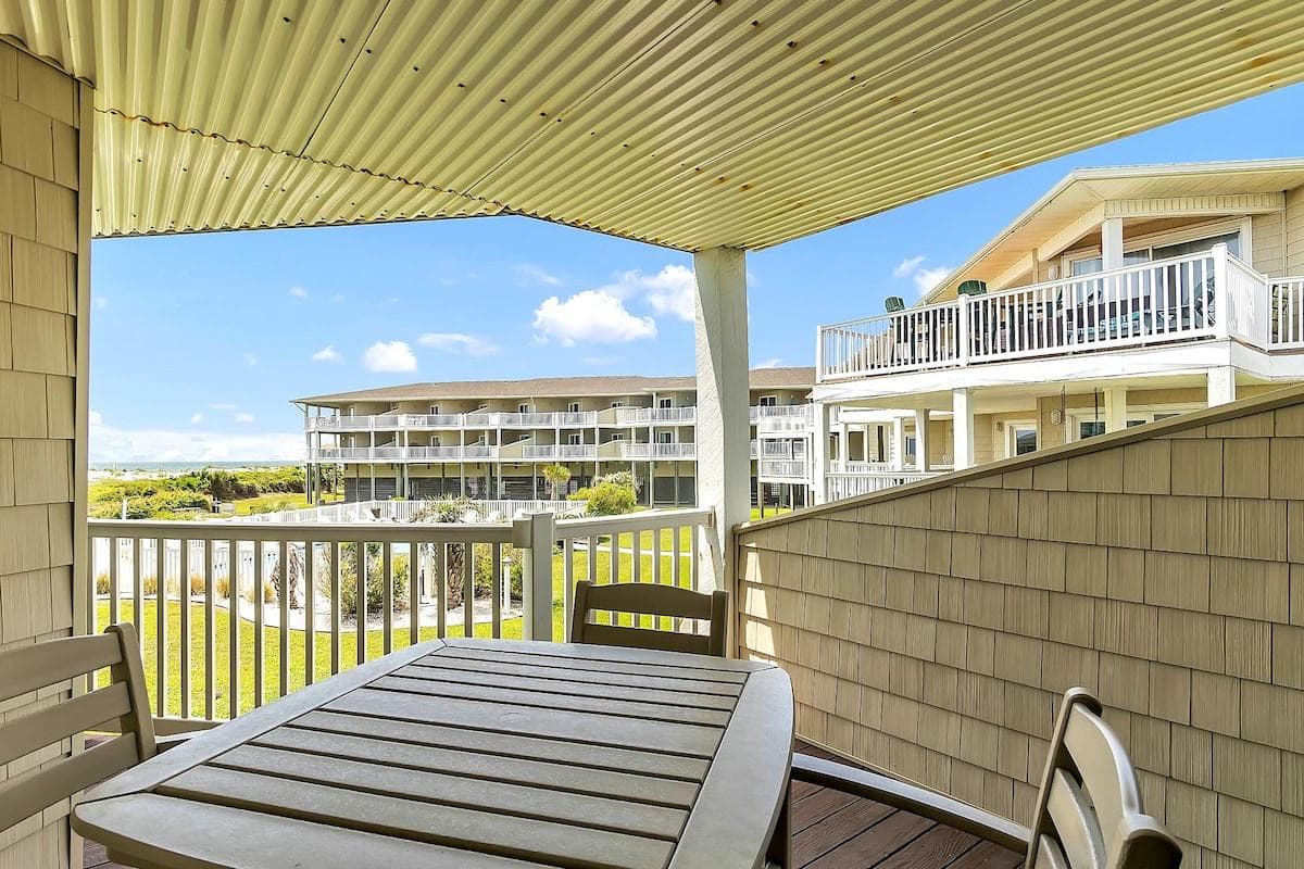Patio hi top table and four chairs with great views of the ocean and pool.